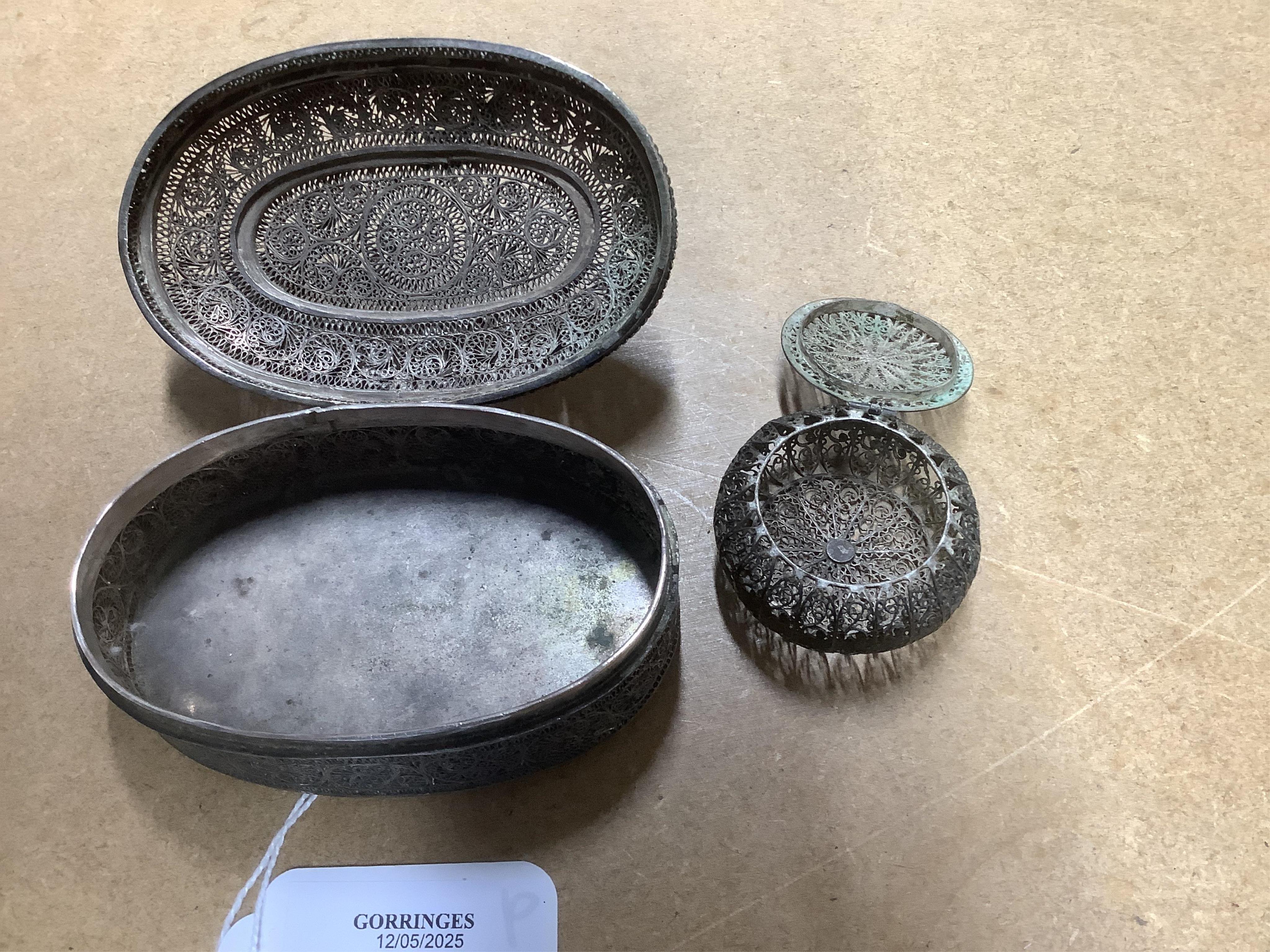 Two Indian filigree white metal boxes, the largest 95mm